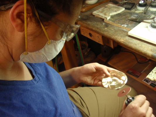 Carley selected bicycle gear from our collection of metal parts along with a amethyst crystal to be cut to fit inside the gear. Carley learned the process of stone cutting, prong setting and soldering through fabricating her own belt buckle. She also made a custom belt to go along with the belt.