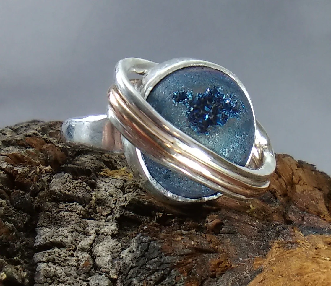 Student-made engagement ring made for his girlfriend; a lover of science.