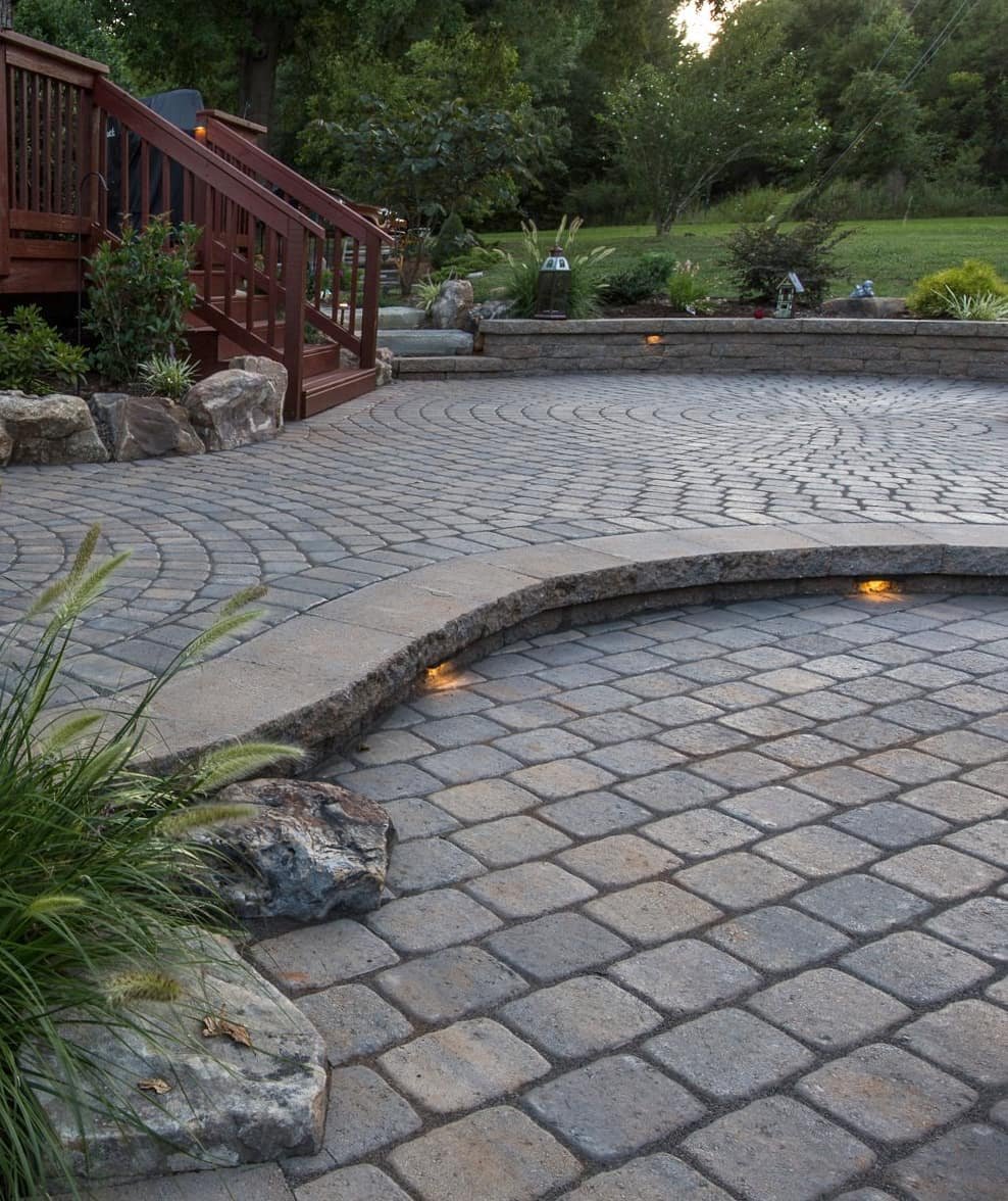 Here's the same project as last post, but looking back towards the main patio from the lower fireplace patio area. 😍 Love the combo of paver patterns! .
.
These pavers are Pavestone Plaza in Earth and Sandstone blend. The walls and steps are Belgard