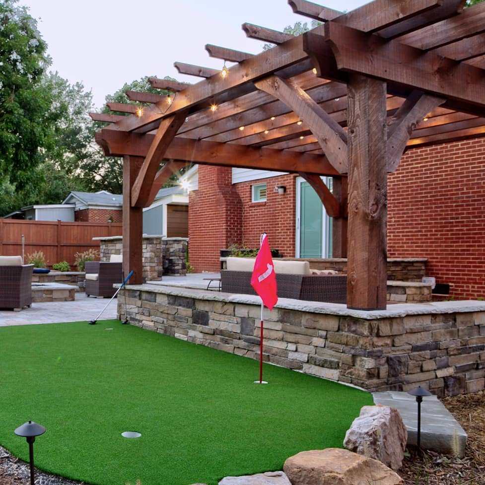 A bonus pic, because it's Halloween 🎃, and we know you wanna see more putting green! ⛳
.
.
This outdoor living space includes a multi-level patio with seatwalls, grill bar, pergola, seating area and firepit. Designed by Josh Smith, a talented landsc