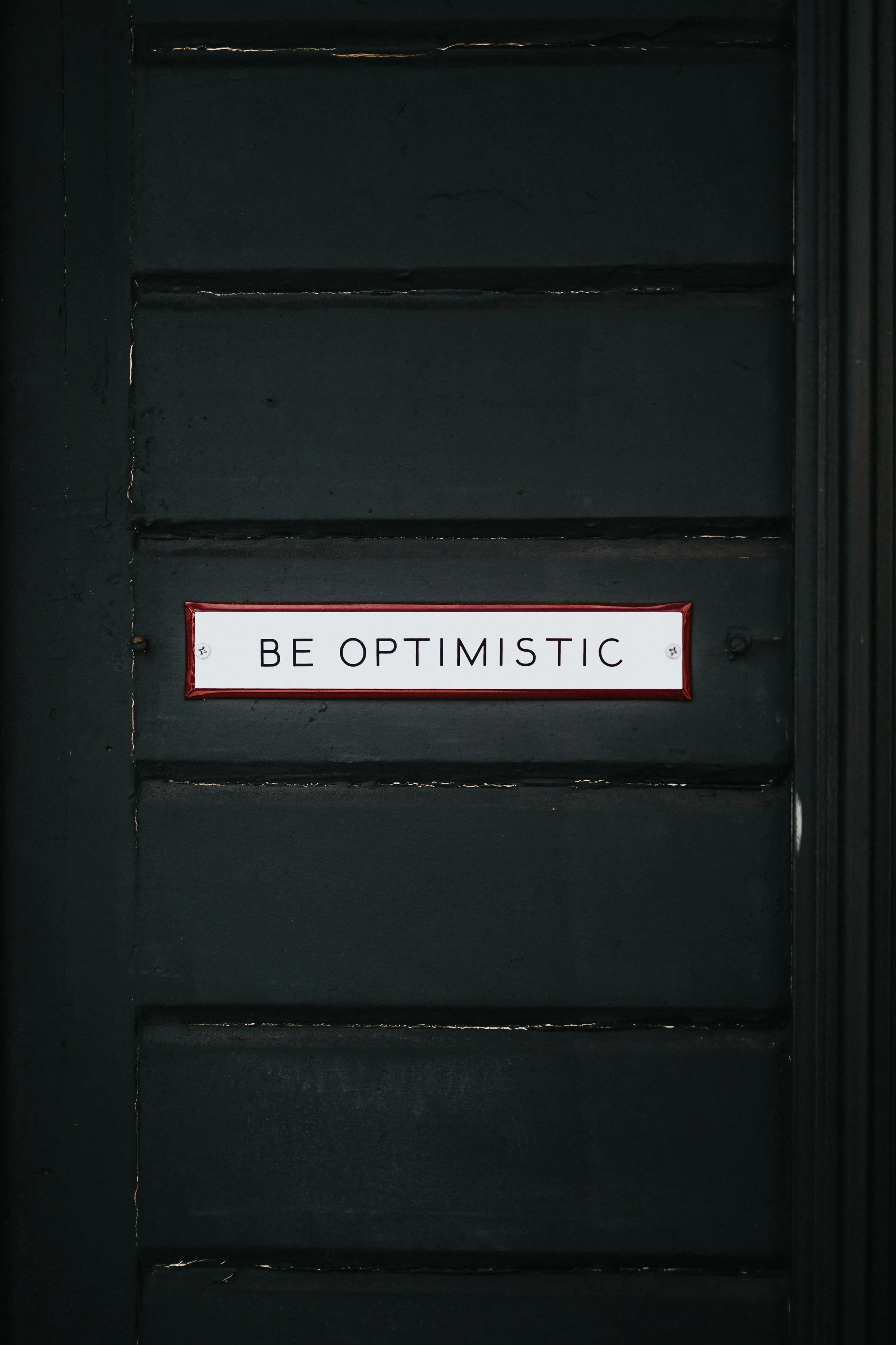 Do we want to settle for optimism? Photo by Nathan Dumlao on Unsplash