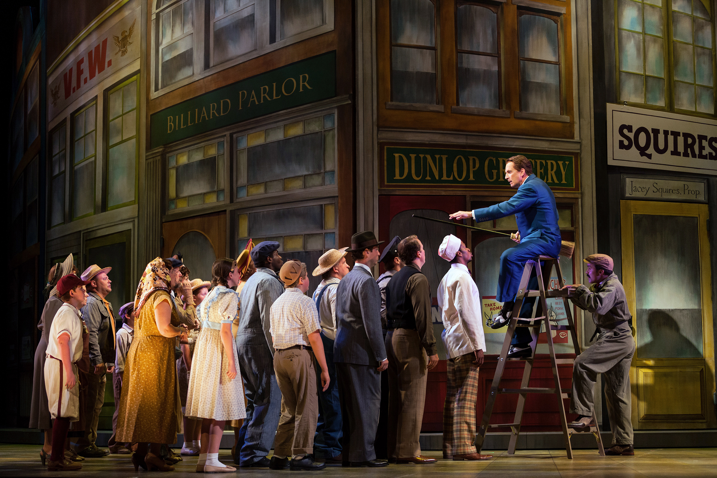  Dwayne Croft as Harold Hill with members of the ensemble in The Glimmerglass Festival's production of  The Music Man . 