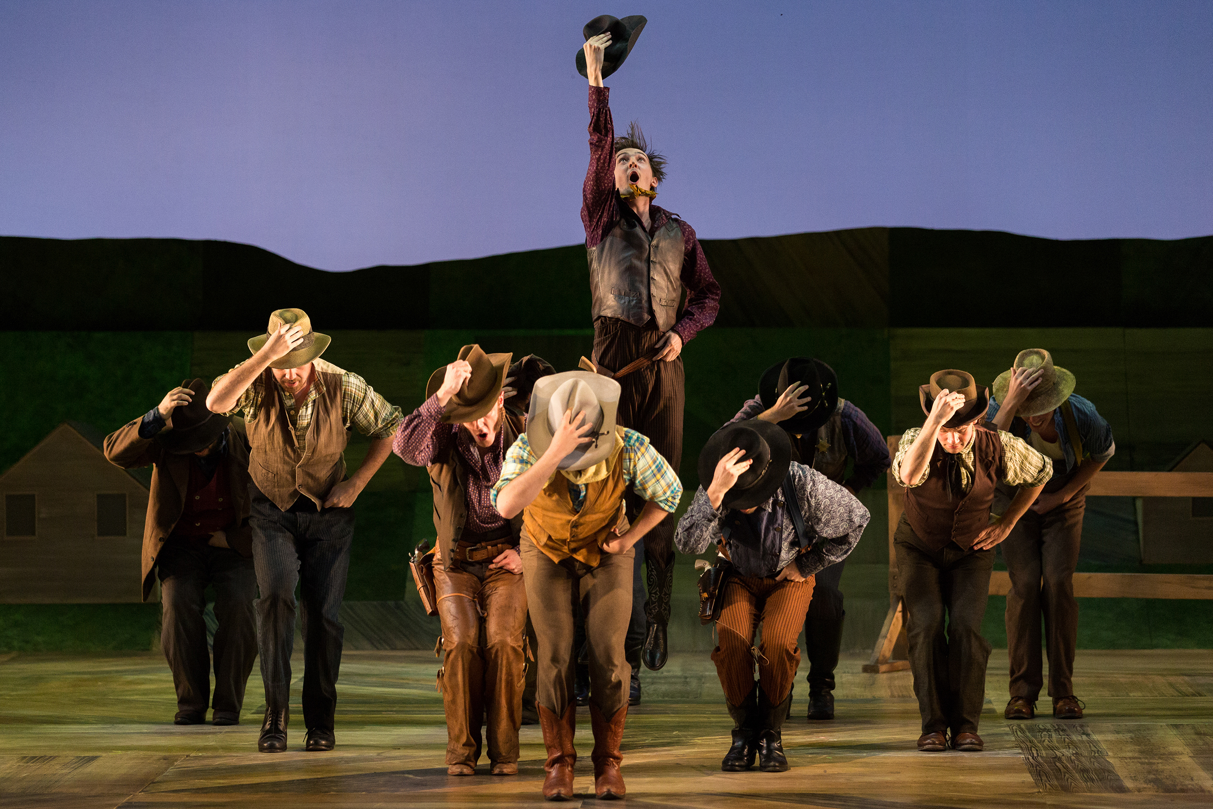  Tucker Reed Breder as Mike (center) and members of the company in The Glimmerglass Festival's 2017 production of Rodgers and Hammerstein's  Oklahoma!  