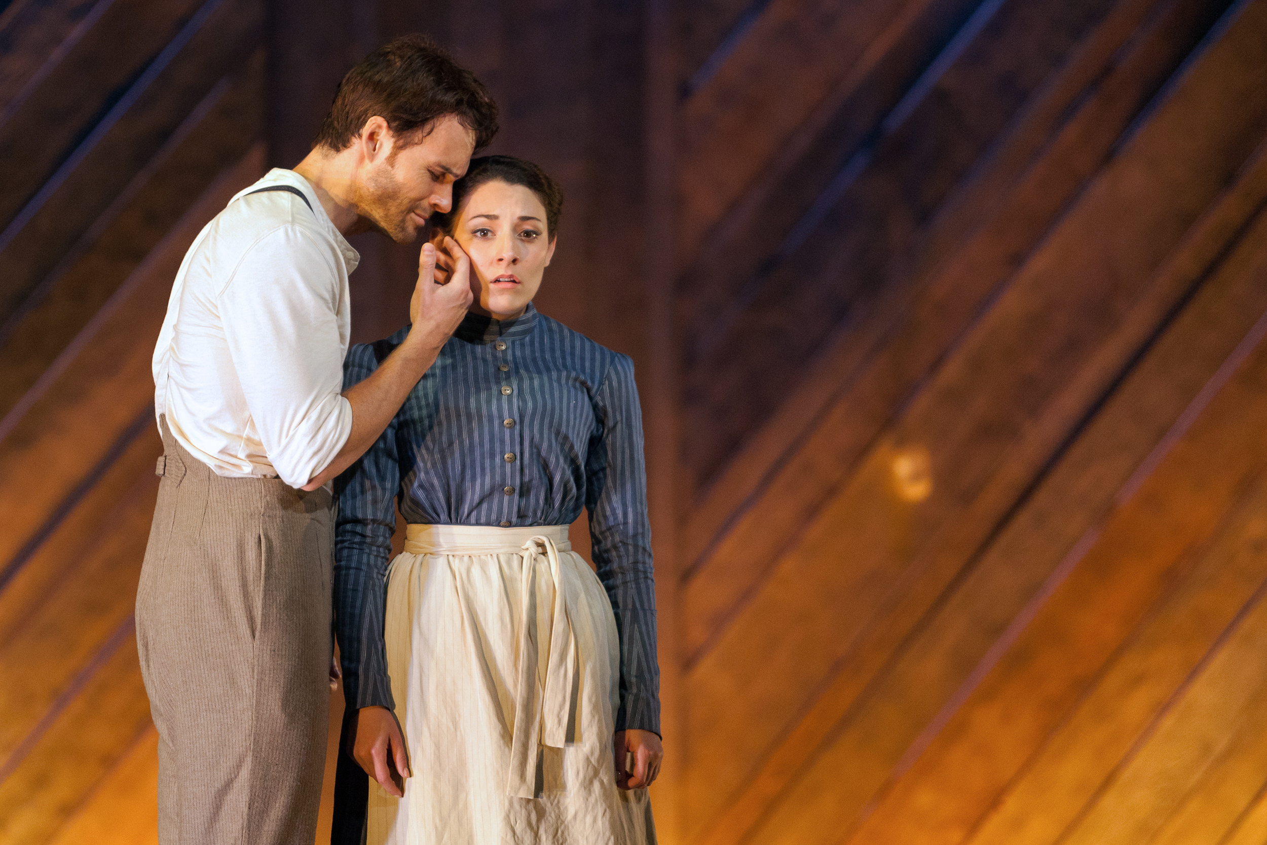  Ryan McKinny as Billy Bigelow and Andrea Carroll as Julie Jordan in The Glimmerglass Festival's 2014 production of Rodgers and Hammerstein's  Carousel . 