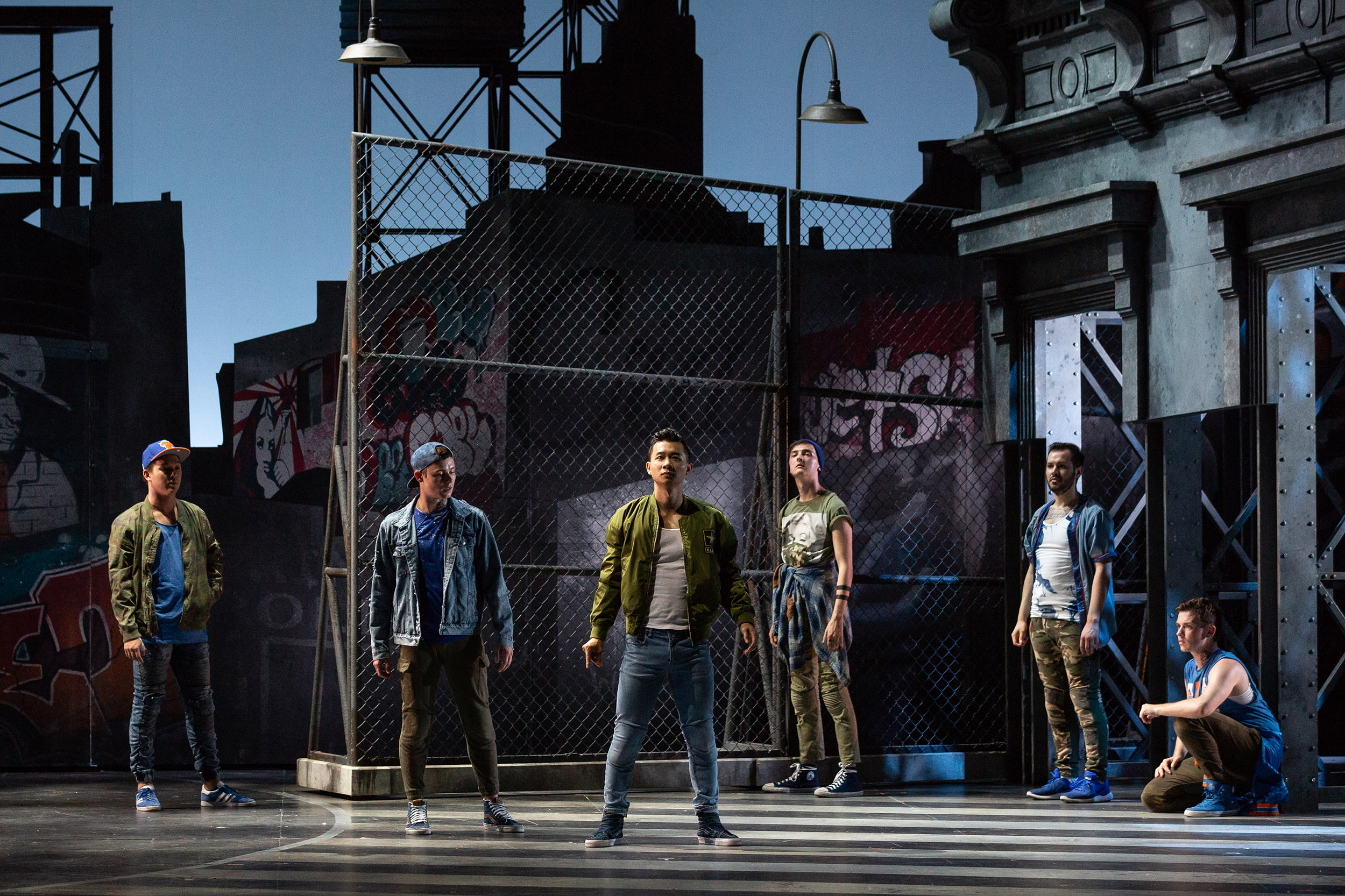  L to R: Spencer Britten as Gee-Tar, PJ Palmer as Action, Brian Vu as Riff, Tucker Reed Breder as Big Deal, Andrew Ryan as A-Rab and Tyler Whitaker as Baby John in The Glimmerglass Festival's 2018 production of Bernstein's  West Side Story . 