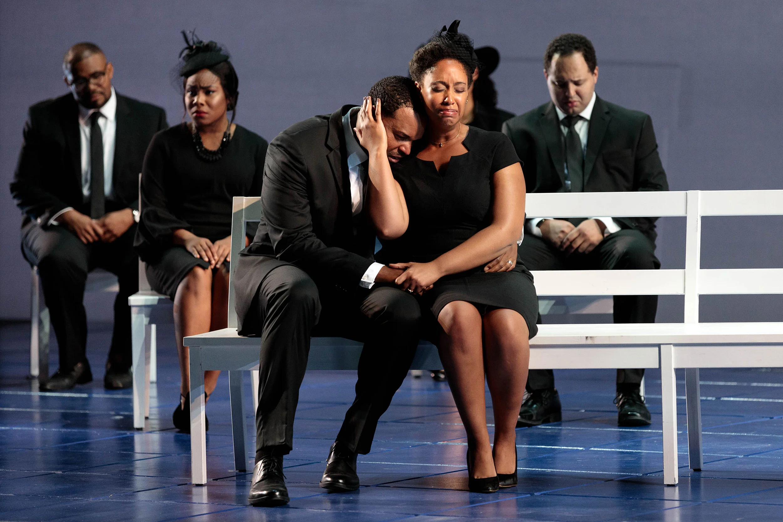 (Front) Kenneth Kellogg as The Father, Briana Hunter as The Mother and members of the ensemble in The Glimmerglass Festival's 2019 world premiere of Jeanine Tesori and Tazewell Thompson's "Blue."