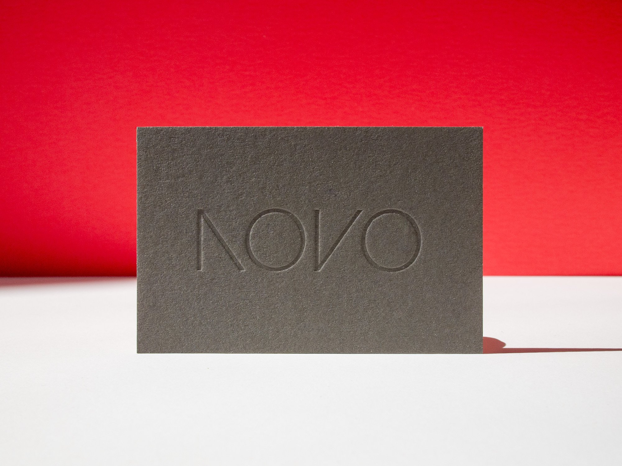 Letterpress Business Card with tonal gray ink on dark gray paper