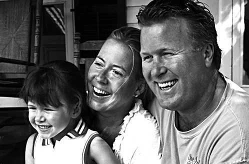 Lexi, Debbie and Norris on the front porch, enjoying the horse and carriages