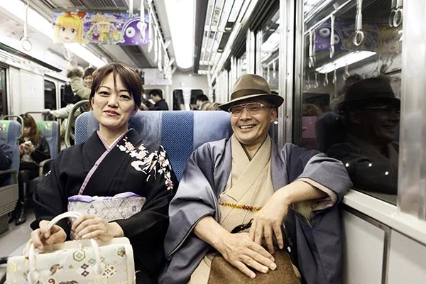 Couple on the Osaka commuter train.