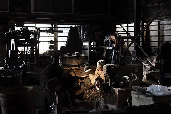 Interior of Kejiro Doi's blacksmith shop, Sakai, Japan