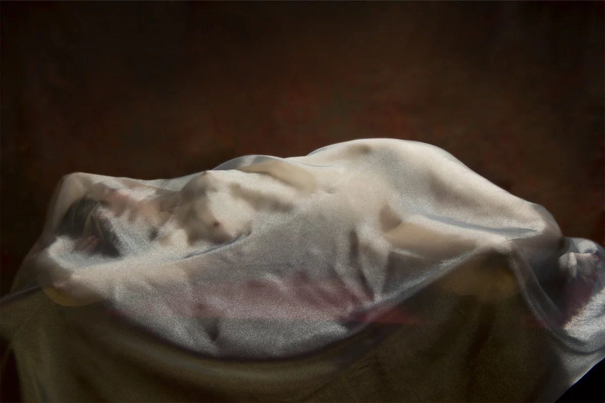 Blue Draped Nude #1 Blue Draped Nude is part of a series and experiments that were first conceived when I was in Italy last autumn. The series is the direct result of the beauty and influences that Italy had on me. It was an unintended consequence from my trip. I originally went to Italy to have be a key to unlock certain artistic impulses within my soul. Venice, Florence and the Tuscan countryside offered just the opportunity to unleash some ideas that have been inside me, but it was an unexpected stop in an art gallery in Positano and subsequent visit to Rome that planted a new seed. I was enthralled with the classic atelier method of painting, plus the allegory found in the paintings of the church and certain classic Italian painting styles. Returning back home these ideas sat inside my subconscious until I was introduced to a new figurative model. With the impetuses to create something with her and working somewhat organically these photos came out of the shoot. I did not think to hard or try intellectualize why I was doing something - I just created. The influence of my trip to Italy is evident in this image. I am not sure if I would have created this image without my experiences last year.