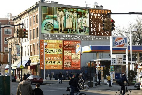 The mural, titled “Achtung Baby … Here Comes the Next Great Depression,” is the first installment for the Great Wall of Brooklyn. 