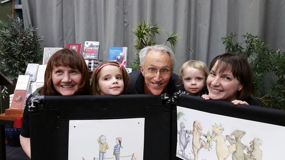 Judy cook (left) and illustrator SONIA nadeau (RIGHT) with friends and family at an event promoting when dinosaurs go dancing