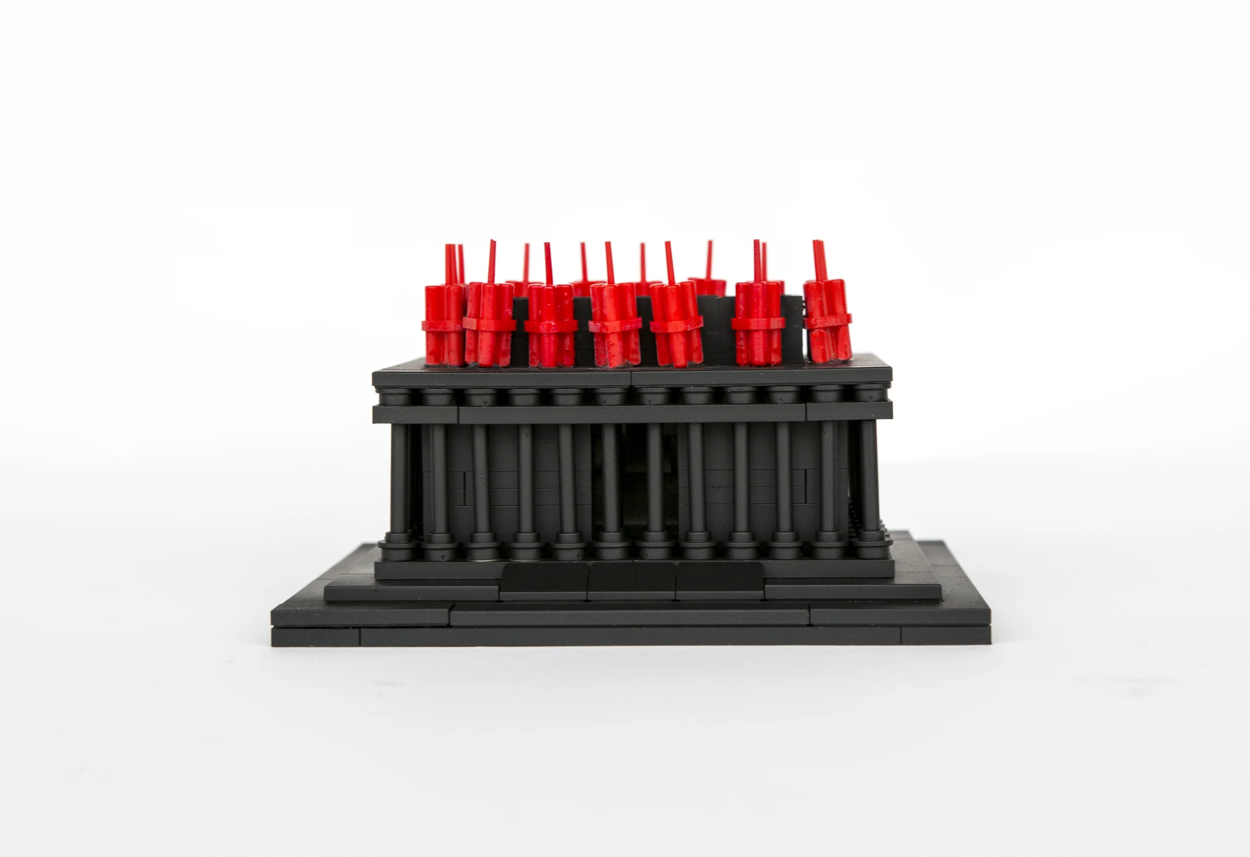 Anti-Monuments for Counter Histories (09/05/1970) , painted lego pieces and plastic dynamite, 2" (6cm) tall, 4" (12cm) wide and 3" (9cm) deep, 2015