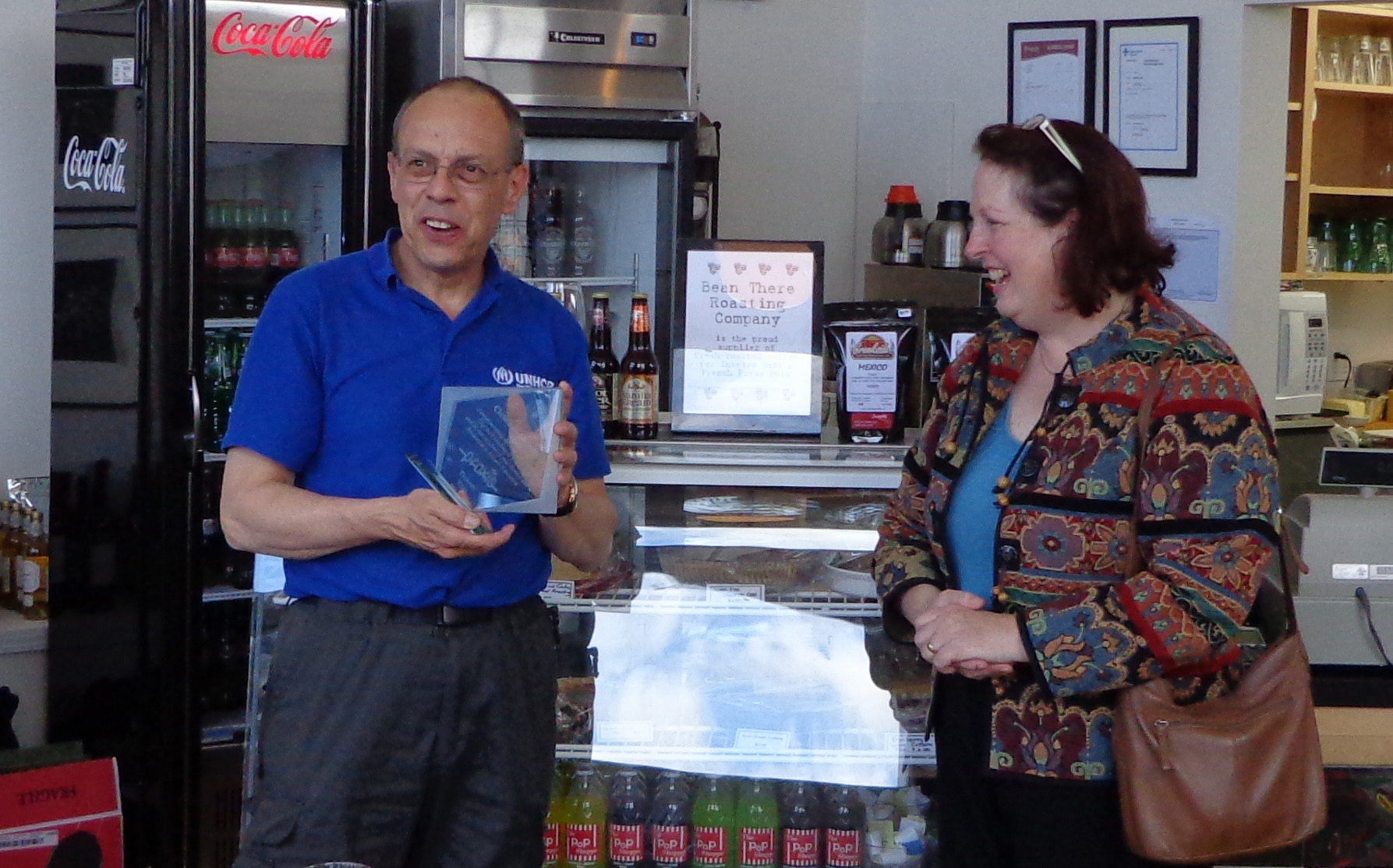Clem accepting an award for his service to Praxis in 2012, presented by Cathy Linowski.