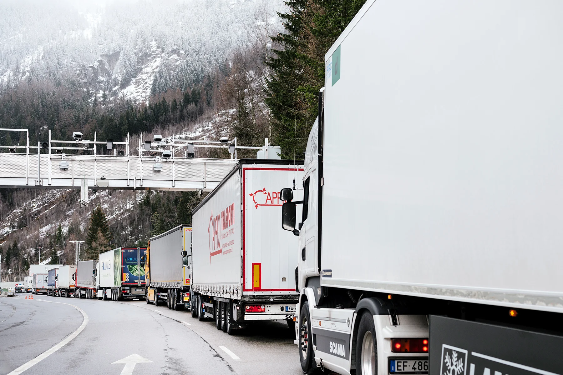 Security cameras looking at the road a few hundred meters before the tunnel du Mont-Blanc french access. Lorries are awaiting for security clearance.