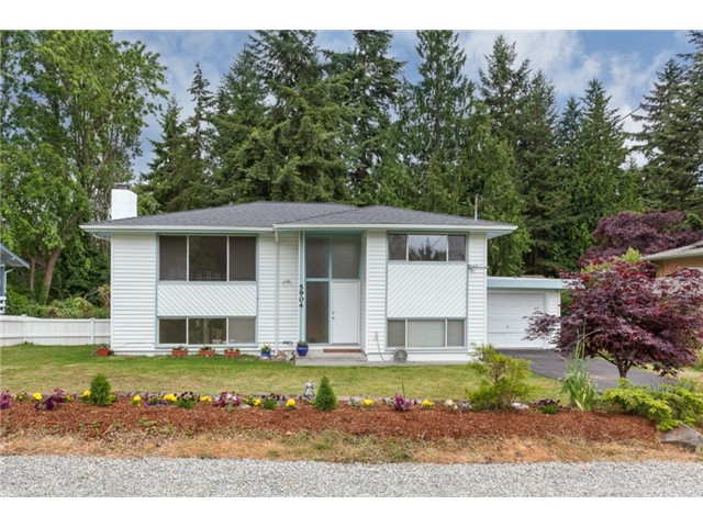 MOVE IN READY!!! BRAND NEW ROOF, fresh paint, new flooring with marvelous well kept original hardwoods! So conveniently close to schools, parks, beaches & bus line... this is a NO BRAINER! Home features FIVE SPACIOUS bedrooms (3up,2dwn) 1.75bath, parking for your RV out front, covered garage, GENEROUS kitchen with eating space, living room & a VERY LARGE rec-room that leads a BIG FLAT yard! All this and both a gas & wood burning fireplace!