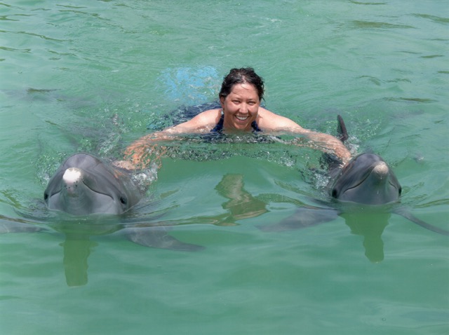Jennifer with dolphins Robala and Coco after a day of CST in the water with the dolphins. Freeport, Grand Bahama
