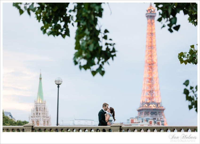 romantic couple in paris underneath the eiffel tower