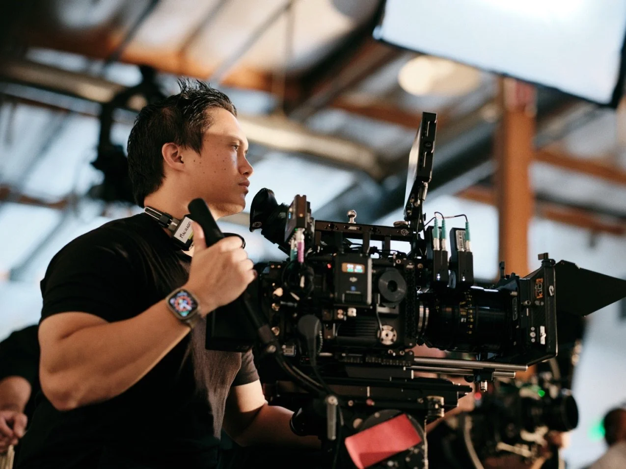 Director of photography filming a restaurant commercial video with a Sony Burano cinema camera in a studio.