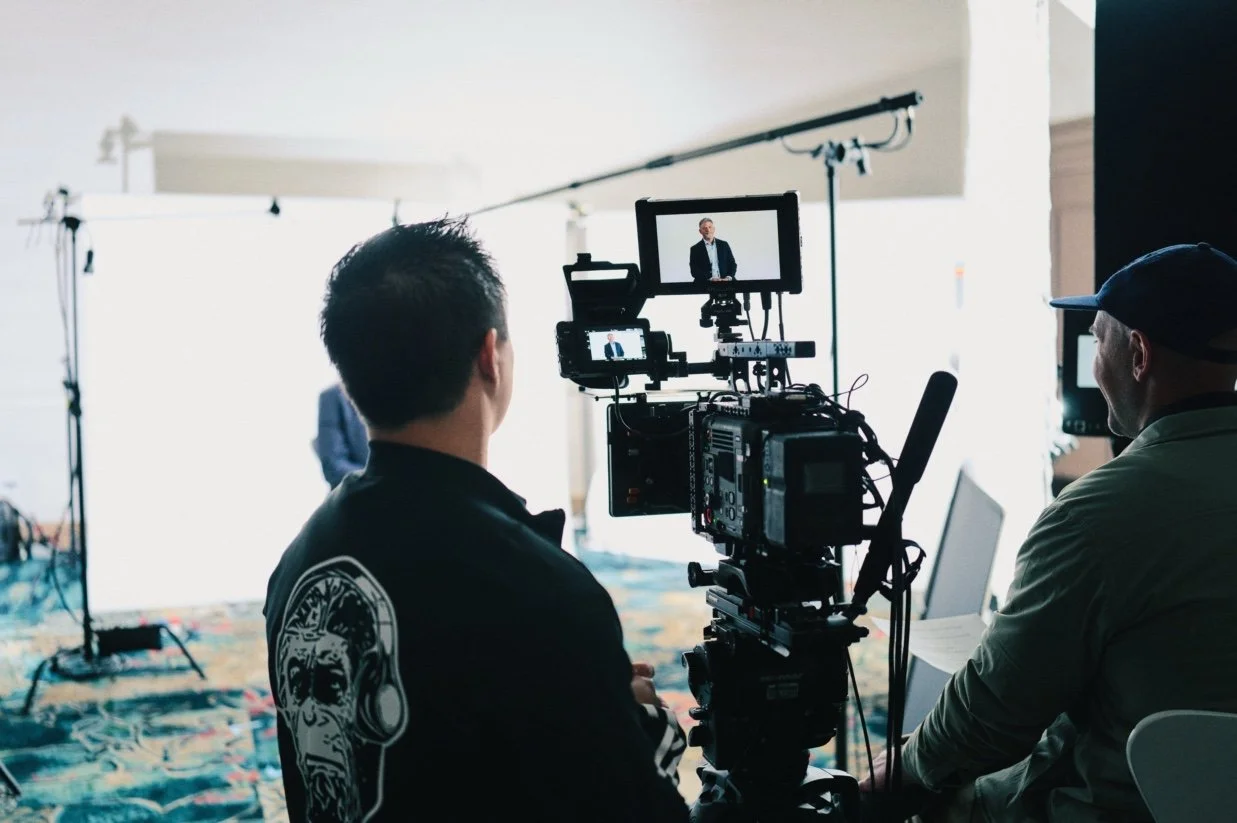 Interview production BTS with a calibrated field monitor used for live exposure/color monitoring.