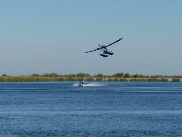 Ultra light dive bombing a jet skier
