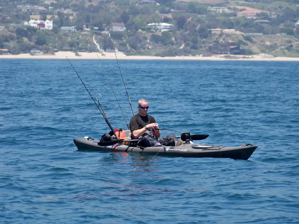 Equipped kayaker reading his sonar