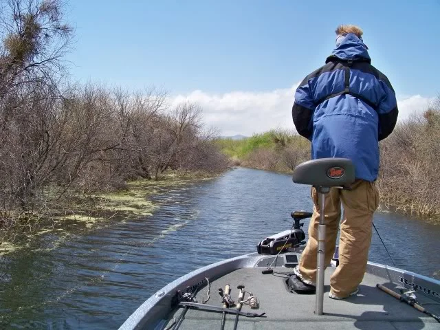 Fishing a flooded road bed