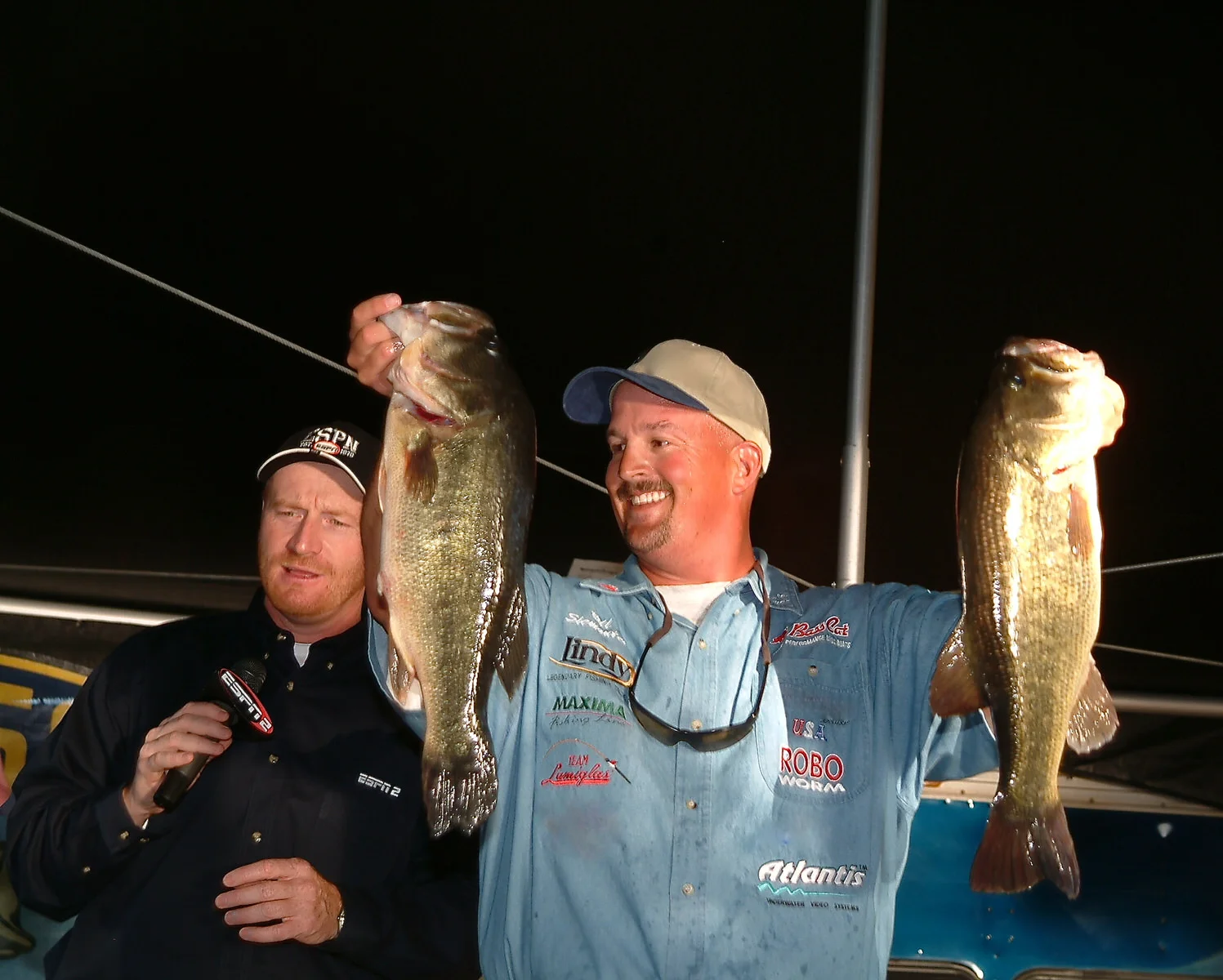 Fish Fishburne at home as the MC with an unidentified angler.