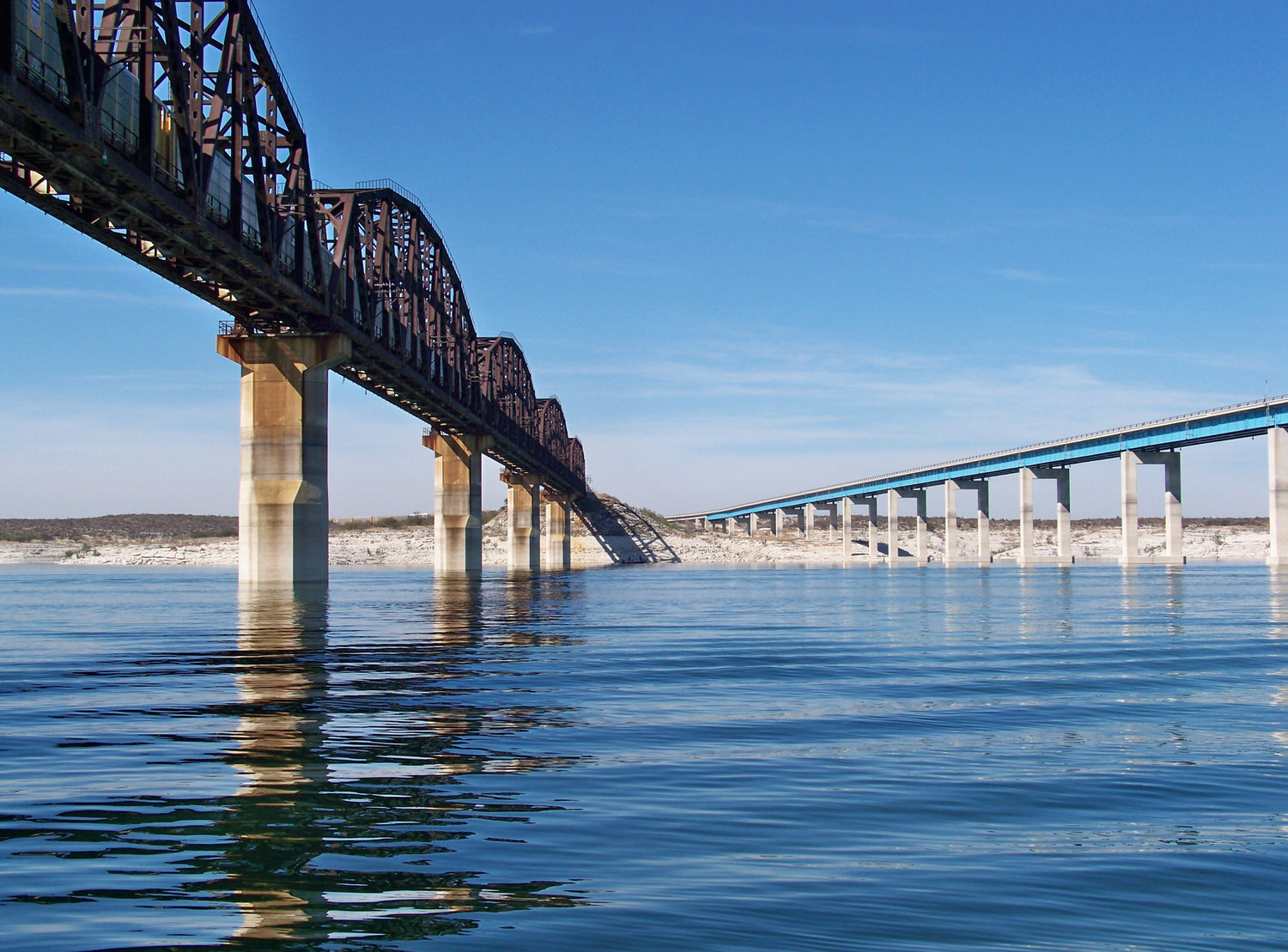 Day 3 brought sunny blue skies and a calm breeze, Highway 90 and Railroad Bridge spanning Amistad