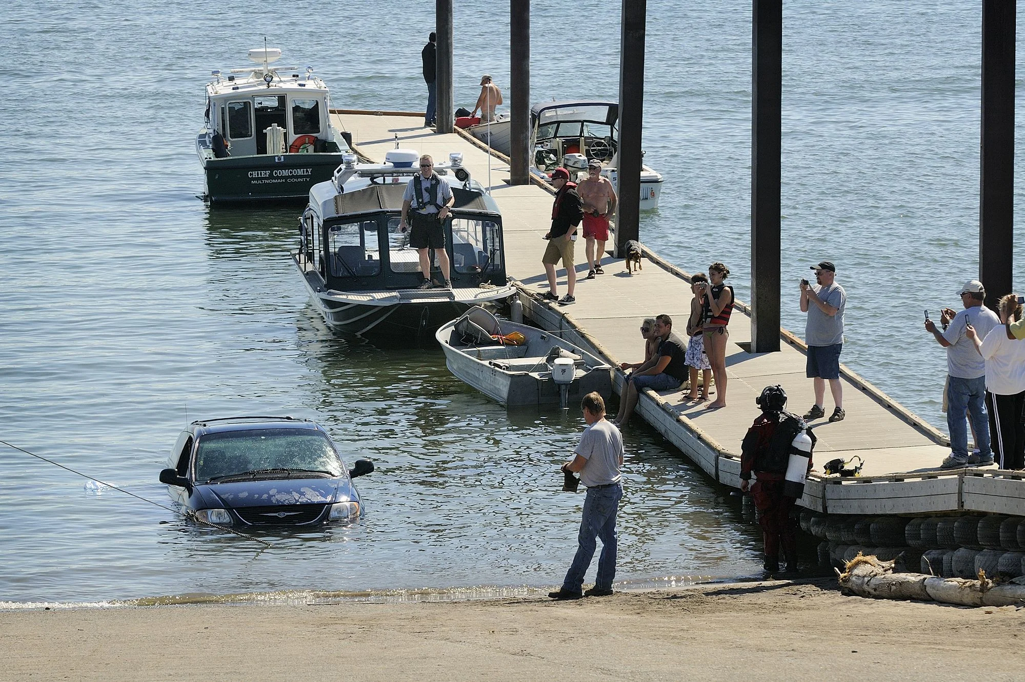 Robert Sharp’s minivan is pulled from the Columbia River at the Marine Park boat launch Tuesday after his wife, Teresa, backed too far down the ramp while putting their boat in the water. No one was reported injured. ( Troy Wayrynen /The Columbian). Be careful what you wish for Mike Jones! 