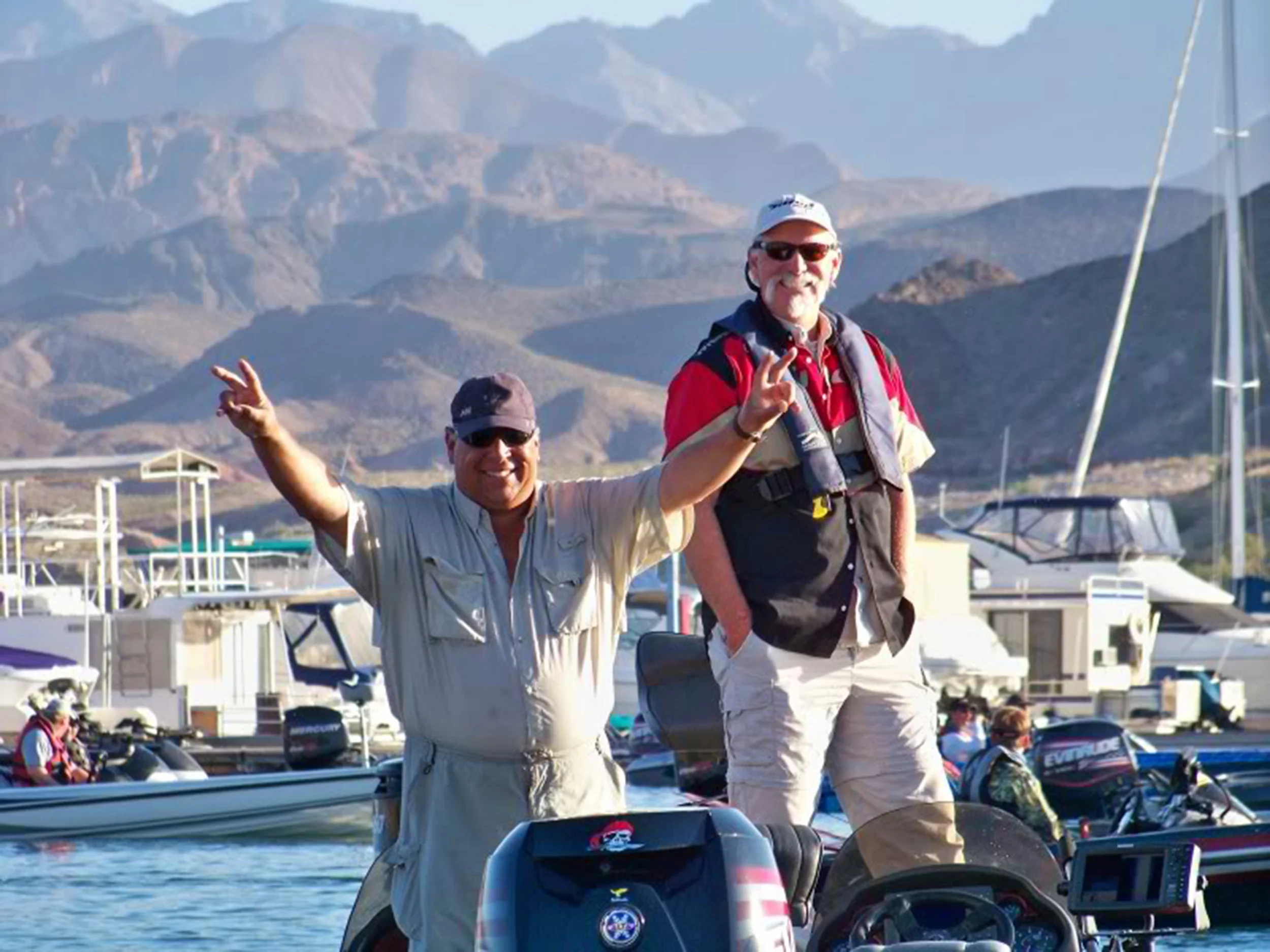 A winning smile and V for victory, Chris (closest to camera) doing what he does best at Lake Mead Nevada! 