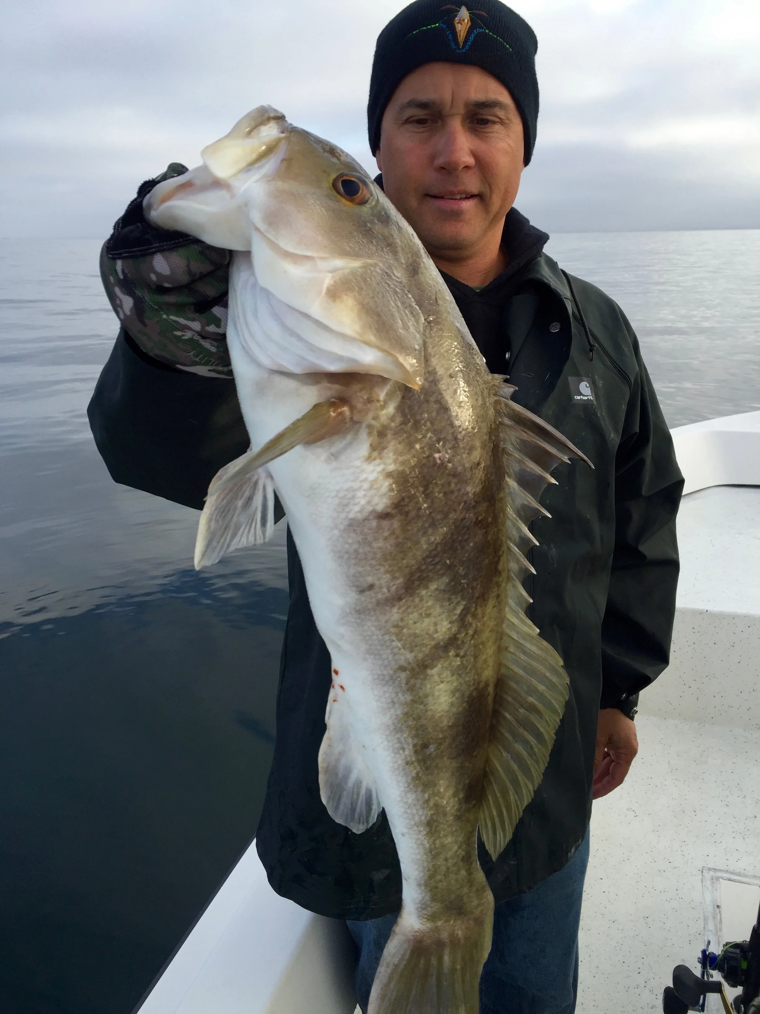 Matt Kobzeff with a toad Sand Bass.