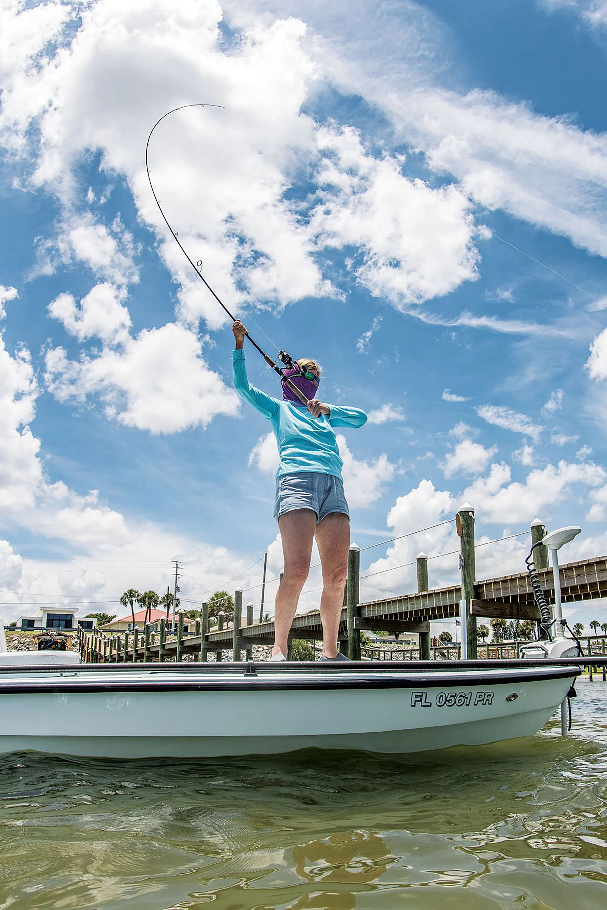 Curse of the high-sticked rod. Even experienced anglers can get a bit too enthusiastic when trying to coax in a big fish near the boat. This is particularly easy to do with fast-taper rods, which can easily snap in the stressed upper portion. In addition, this angler is making a second error that can lead to a broken rod by holding her hand far up on the rod blank, above the upper grip, where it should be. This alters the load dynamics and places stresses on the rod for which it wasn’t designed. Adrian E. Gray