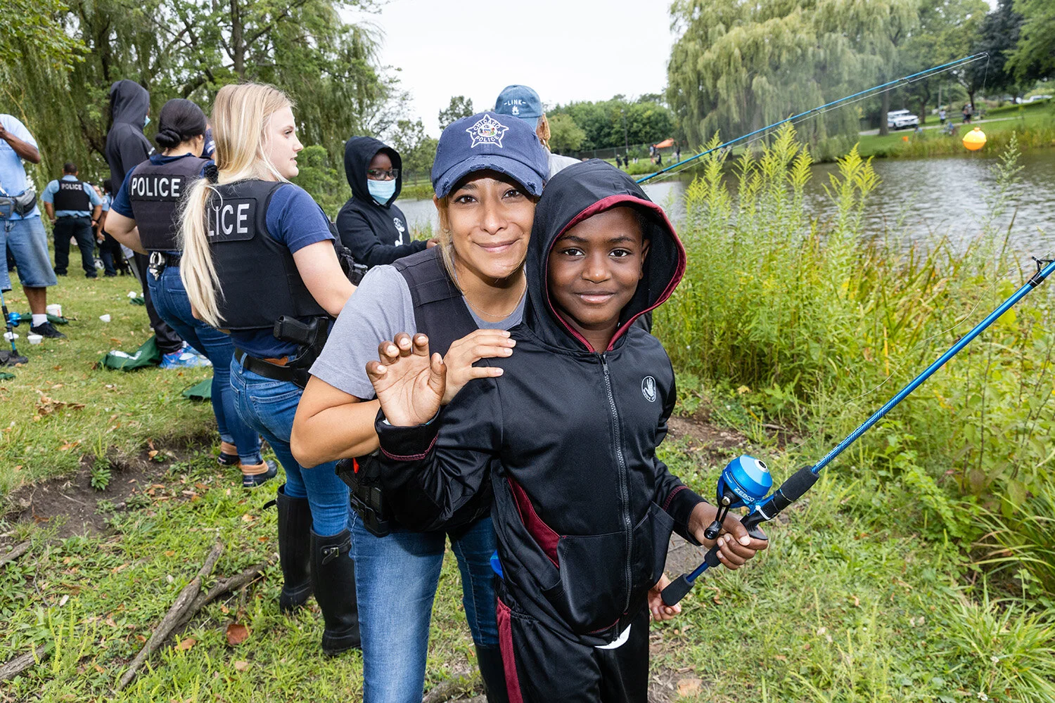 CHICAGO POLICE, FIREFIGHTERS HELP YOUTHS CATCH THEIR FIRST FISH