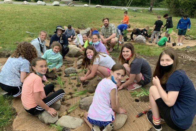 SCHOOL KIDS GET THEIR HANDS DIRTY FOR HEALTHY TROUT
