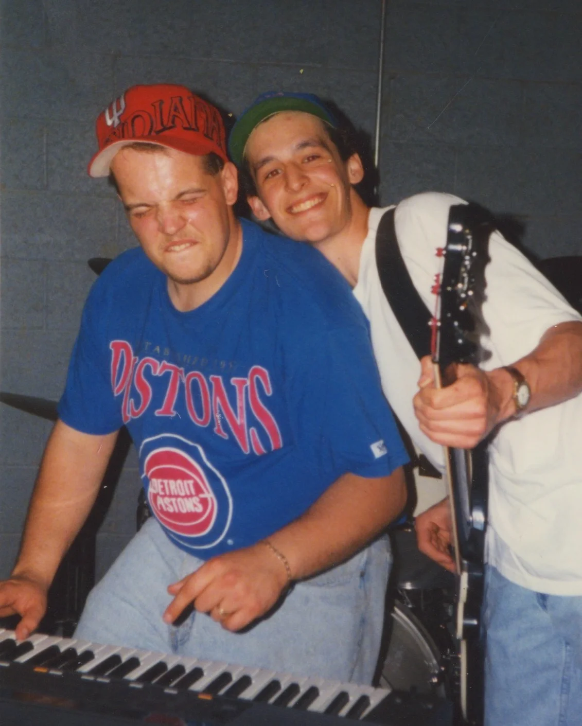 Justin and Eric in 1996. Eric is the one smiling, while Justin drops the hammer on a Bb.