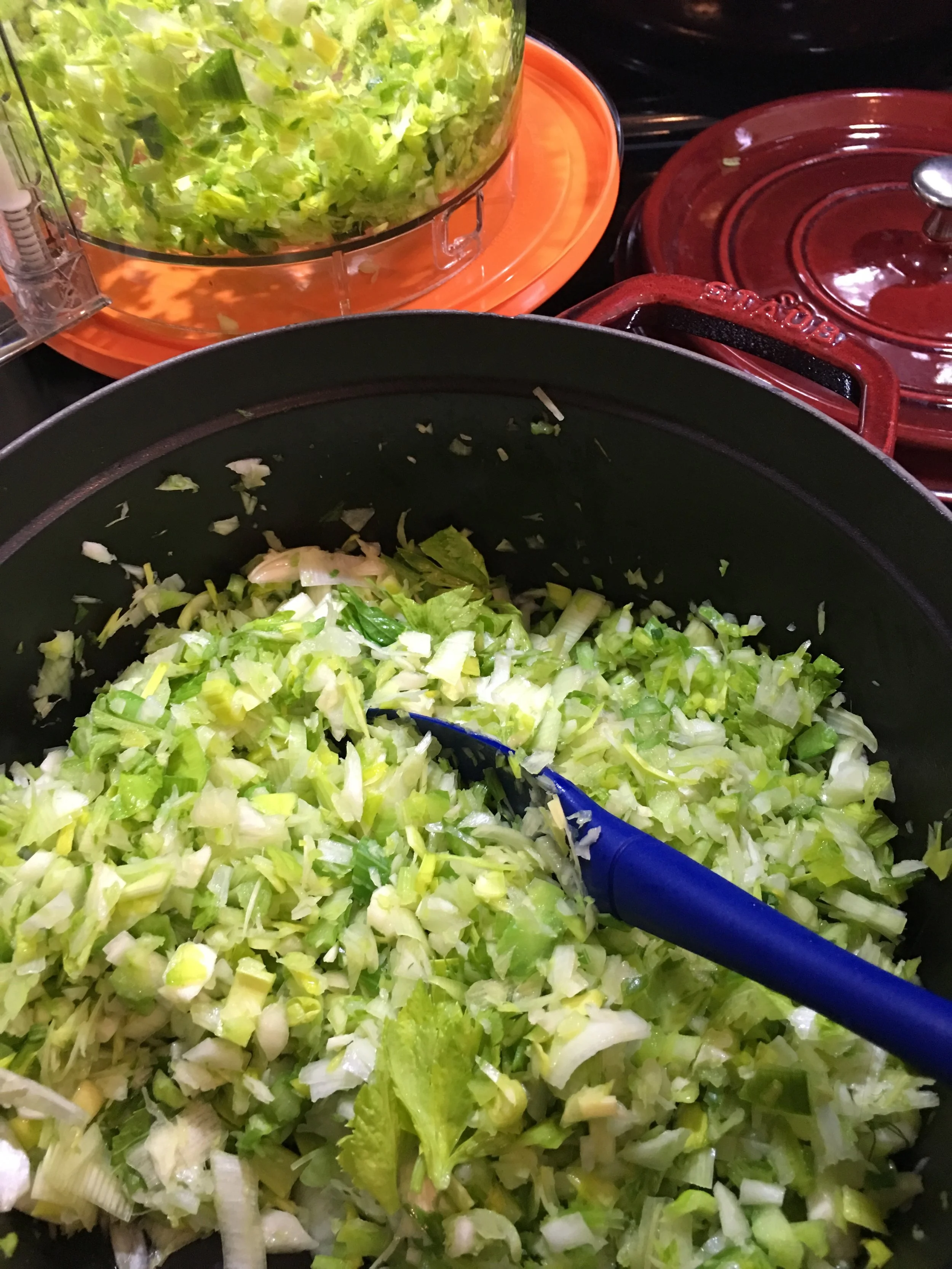Leeks alone are in the food processor, upper left, while the Staub ‘Dutch oven’ has a medley of chopped fennel bulb, celery, and leek. ALL of the leek, white to dark green!