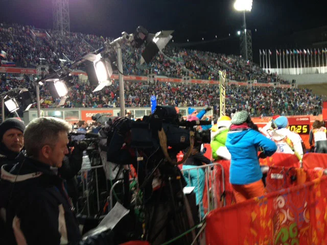 More than 8,000 people crowded the RusSki Gorki Jumping Center to watch the women jump for the first time in the Games while media outlets crowded the mixed-zone.