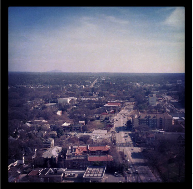 Rooftop view of Atlanta Georgia below. Stone Mountain in left hand side of view