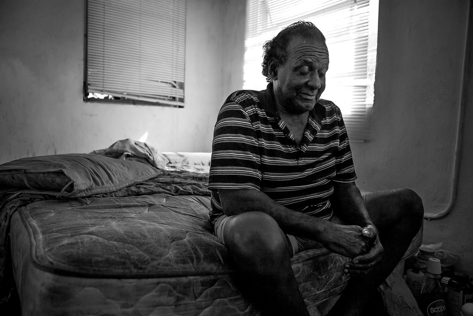  Inman Maloney Jr., 70, sits on his bed in the house he shares with his 91-year-old mother Catherine. Inman and one of his brother have disabilities so Catherine continues to care for them in the house where she raised 10 sons. 