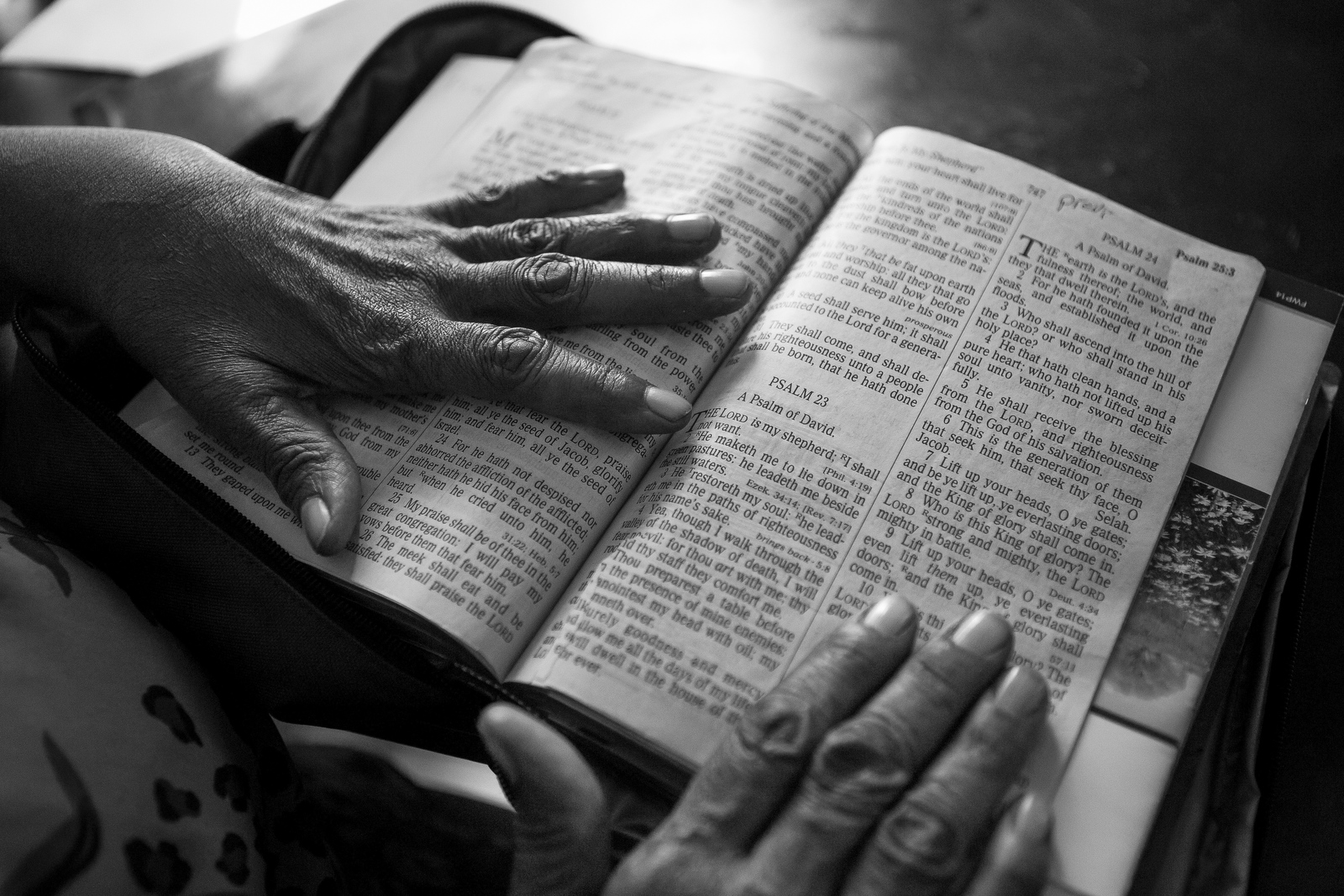  Imogene Davis opens the Bible to her favorite Psalm at her house in Belle Glade. Imogene's previous home caught fire and the family lost everything. Imogene says that her faith helps to keep her going, but sometimes she gets overwhelmed and can't st