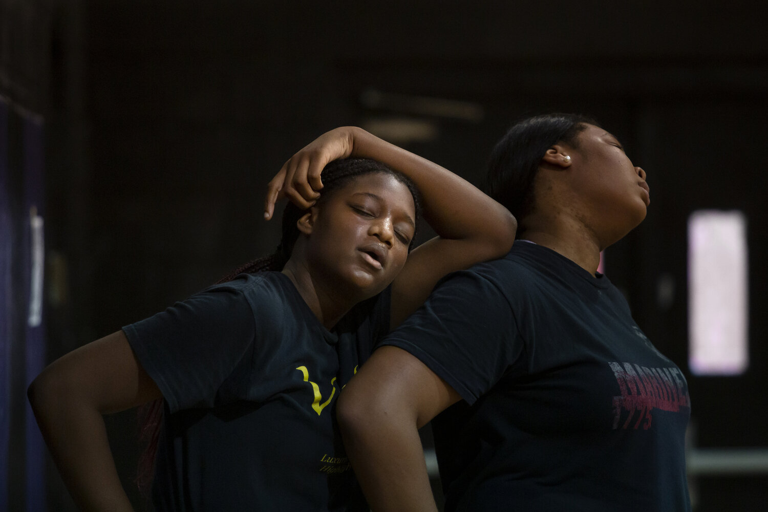  Winter Lane, left, the only sophomore on the varsity team, leans on senior Anzaryia Cobb, right, during pre-season training sessions last summer.  