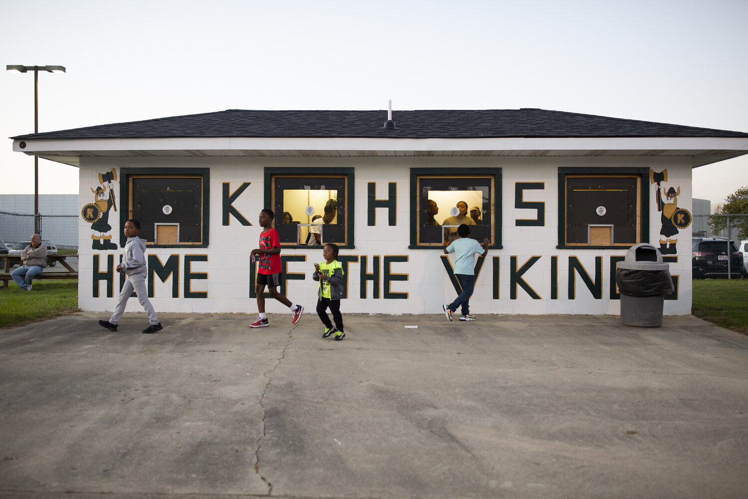  Seniors on the girl's basketball team volunteer at the concession stand during a boy's football game. The girls spend as much time together off the court as they do playing together. Their team chant which echoes throughout the locker room before ga