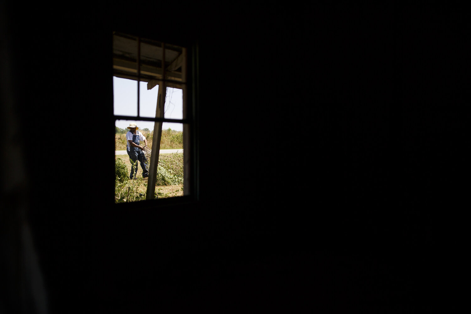  Tony Shackleford hauls brush on his father’s farm. Tony works in IT but comes home occasionally to help. Although his parents would like to pass the farm onto their son, they also understand that farming can be a difficult life. 