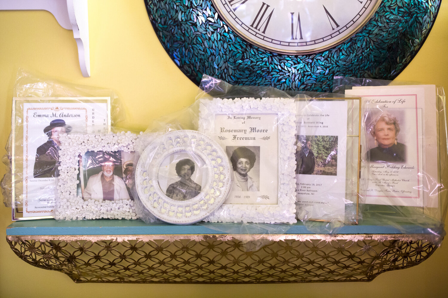  Funeral programs sit on a shelf in Evangeline Grant’s home in Tillery. 