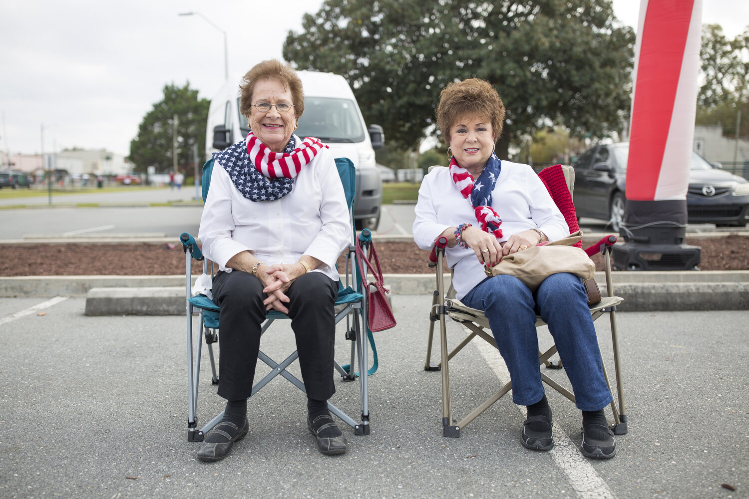  Joan Best, left, and Kempie Riley, right, listen to a band during Veterans Day celebrations in Warsaw. Veterans Day holds a special place in Best’s life. “I’ve had two husbands and both of them are veterans,” she laughs and her daughter was born on 