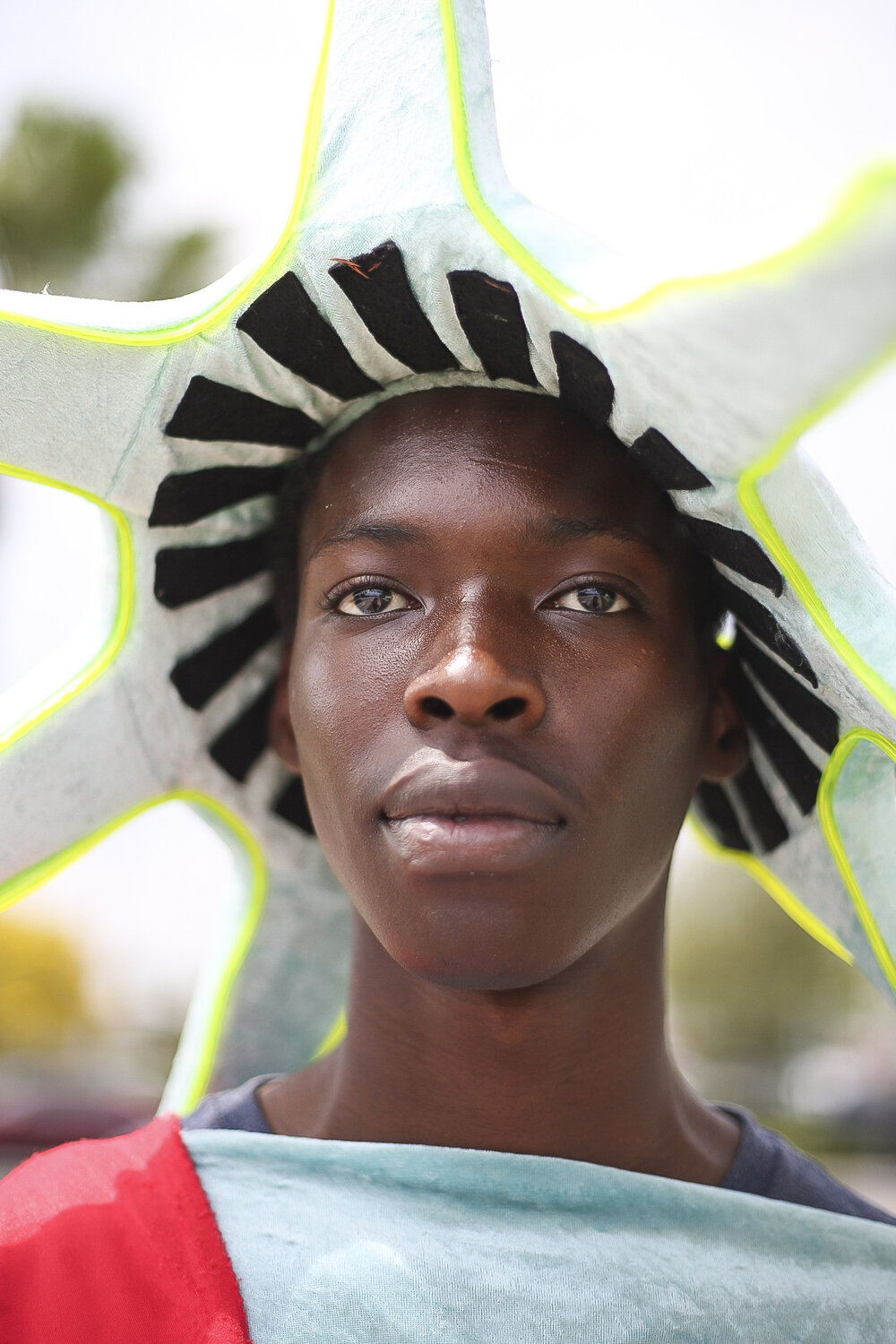  Taric Thomas, 19, of Lake Worth, dresses as the statue of liberty to advertise for Liberty Tax services. Taric said he applied for a job at every store in the shopping plaza but Liberty Tax was the only one that called him back. 