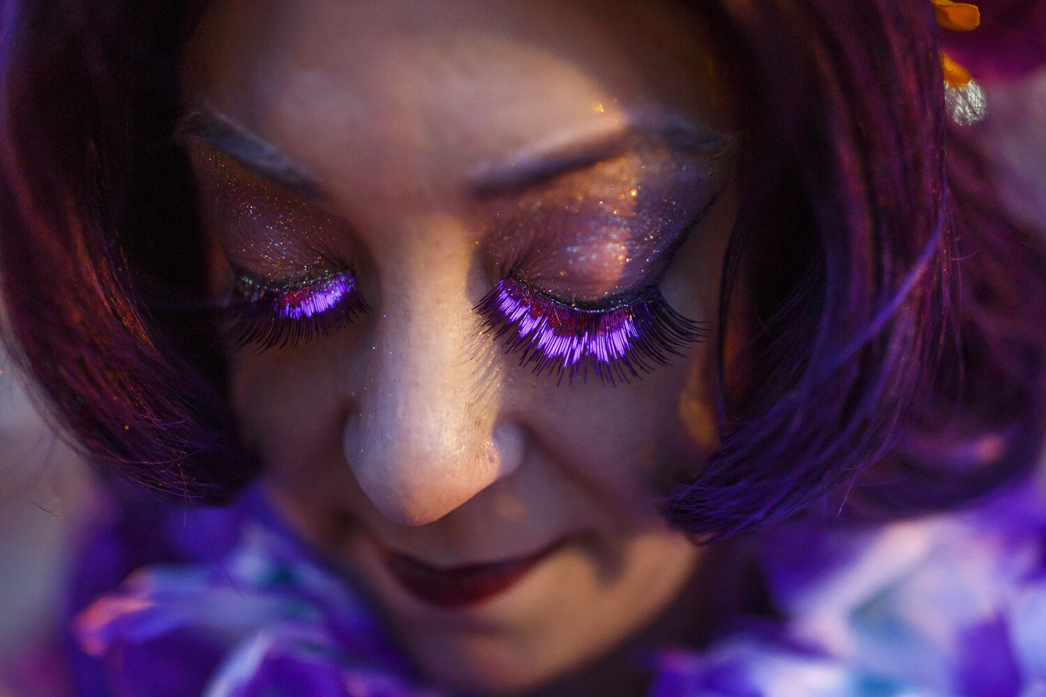  Lori Glenn, of Durham, wears purple eyelashes to complete her outfit as queen of the Mardi Gras celebration in downtown Durham. 