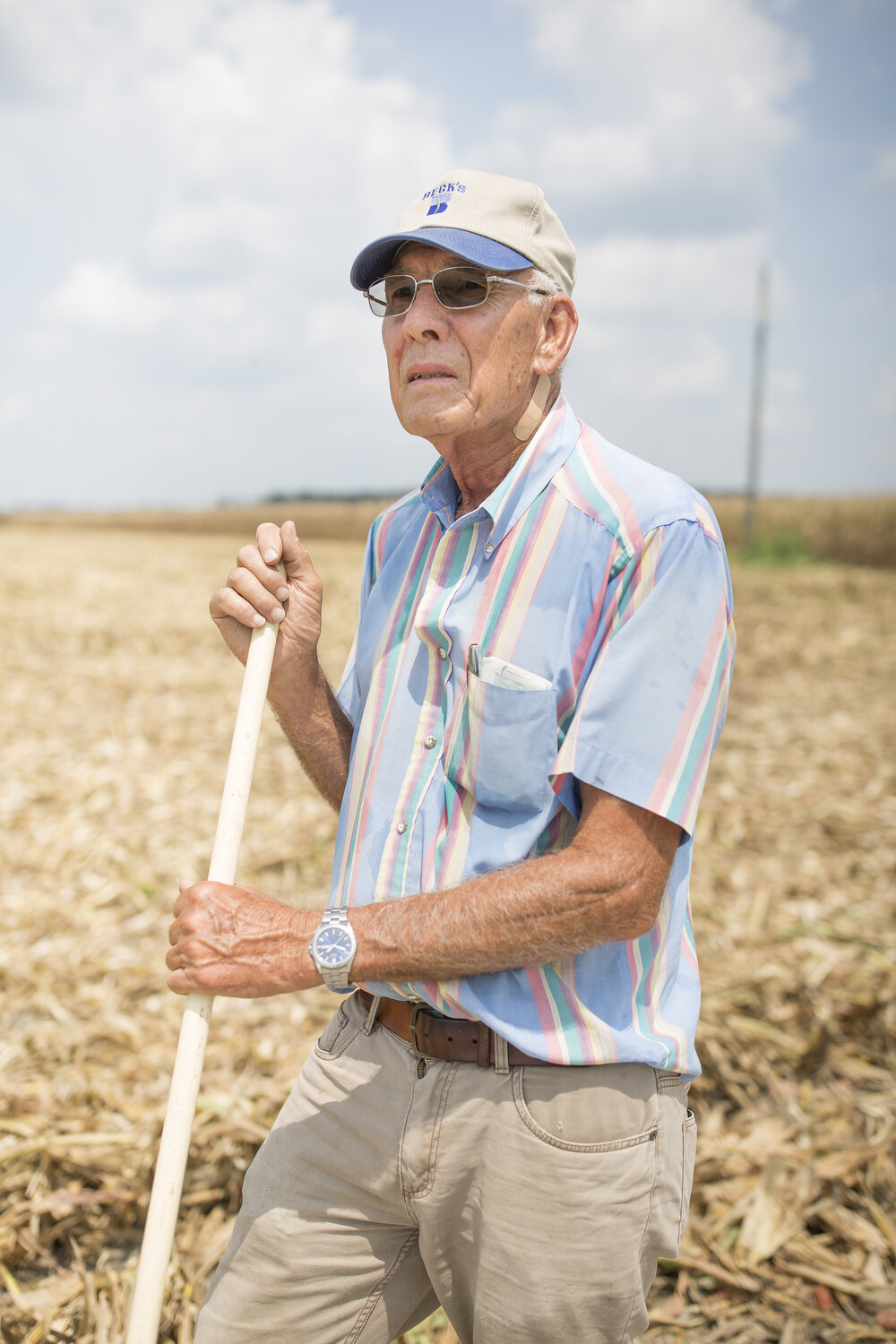  Frazier Hardy, 77, rakes up discarded ears of corn to keep a neighboring farmer’s land clean after he and his family were harvesting corn. Hardy and his 80-year-old brother Sylvan Hardy are still active farmers who grow corn to feed livestock or to 